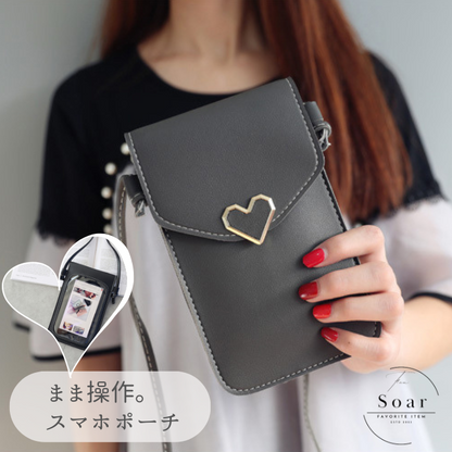 Soar ｜可愛いハートチャームのスマホショルダーポーチ｜ ソア ポーチ スマホ ポシェット ショルダー ストラップ バッグ ミニバック 小物入れ スマホポーチ 肩掛け 可愛い 上品 高見え 便利 持ち運び ショッピング ブランド レディース おしゃれ 携帯 iPhone15 アイフォン 斜めがけ かわいい スマホ ハート ゴールド