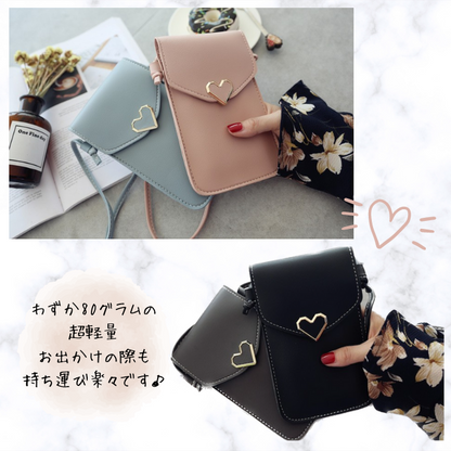 Soar ｜可愛いハートチャームのスマホショルダーポーチ｜ ソア ポーチ スマホ ポシェット ショルダー ストラップ バッグ ミニバック 小物入れ スマホポーチ 肩掛け 可愛い 上品 高見え 便利 持ち運び ショッピング ブランド レディース おしゃれ 携帯 iPhone15 アイフォン 斜めがけ かわいい スマホ ハート ゴールド